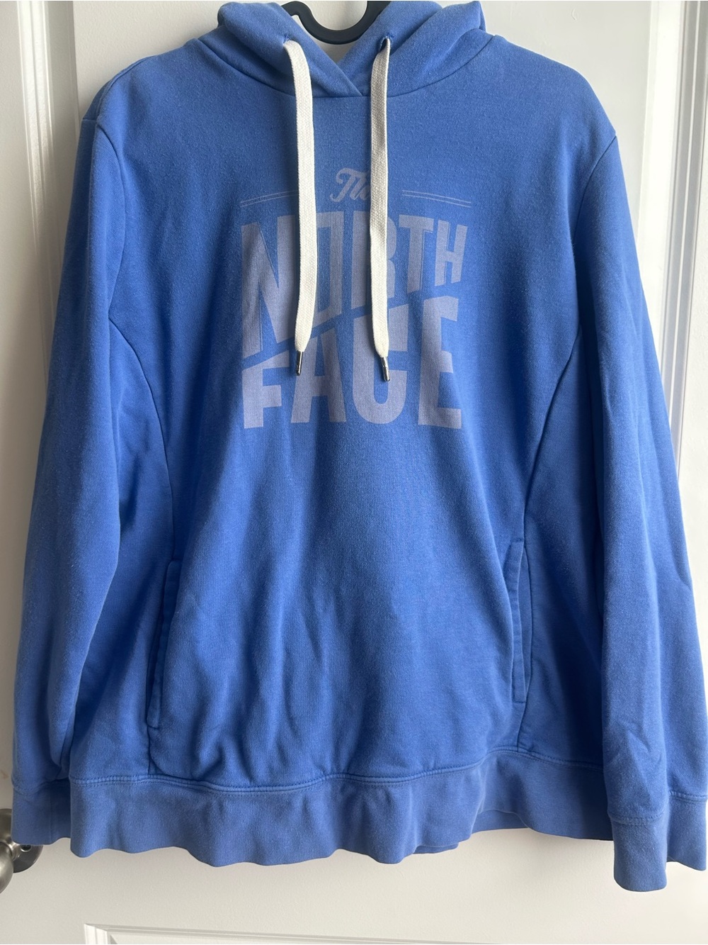 The North Face Blue Logo Pullover Hoodie with White Drawstrings